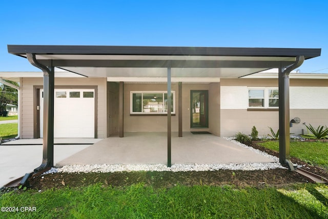 rear view of house featuring a garage