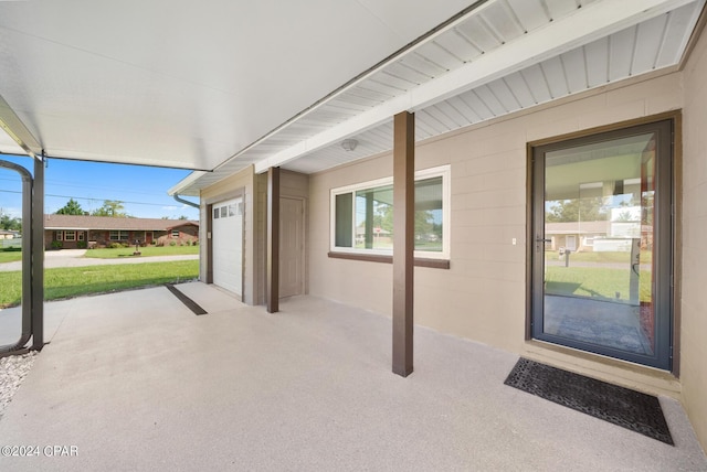 view of patio / terrace featuring a garage