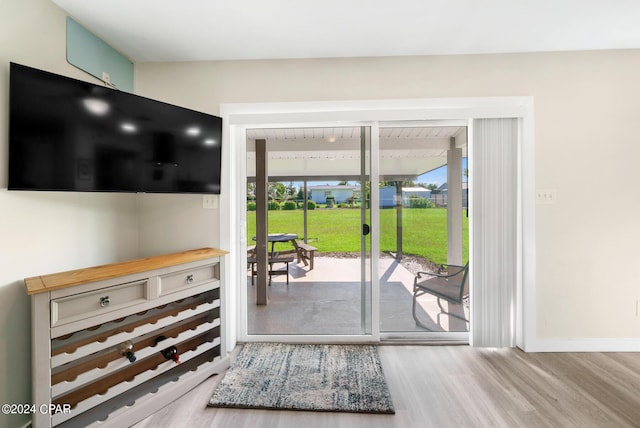 doorway to outside featuring light hardwood / wood-style flooring