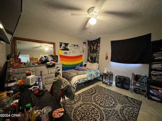 bedroom with a textured ceiling and ceiling fan