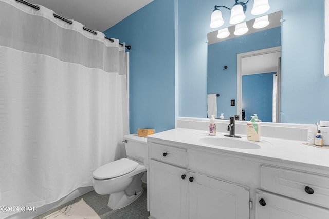 bathroom featuring vanity, toilet, and curtained shower