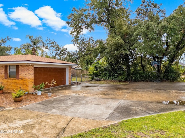 view of side of home featuring a garage