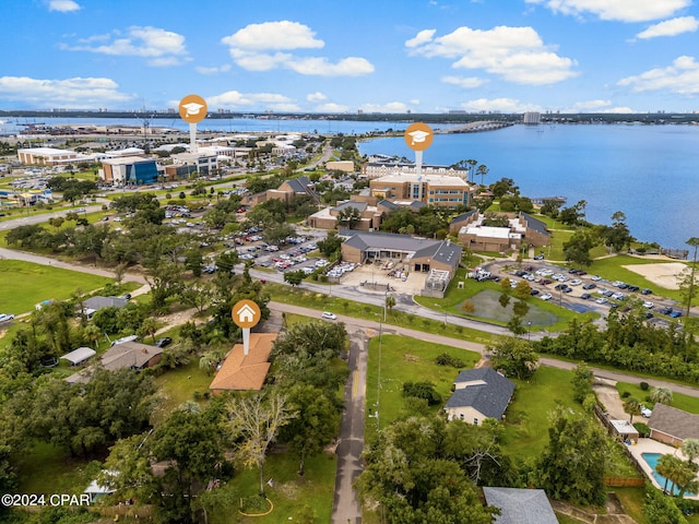 birds eye view of property with a water view