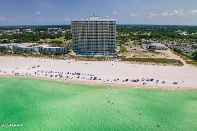 birds eye view of property with a view of the beach and a water view