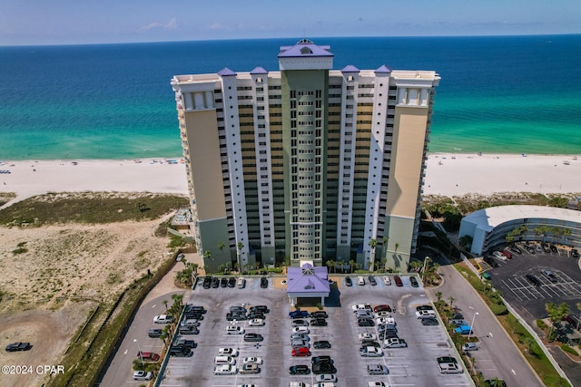 aerial view with a water view and a view of the beach