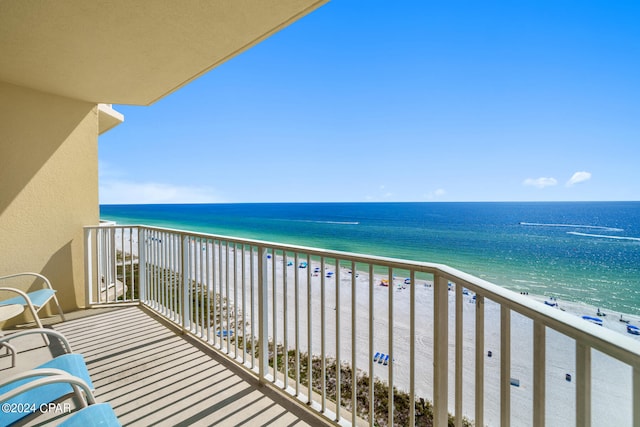 balcony with a view of the beach and a water view