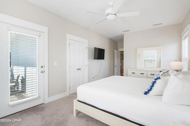 carpeted bedroom featuring access to outside and ceiling fan