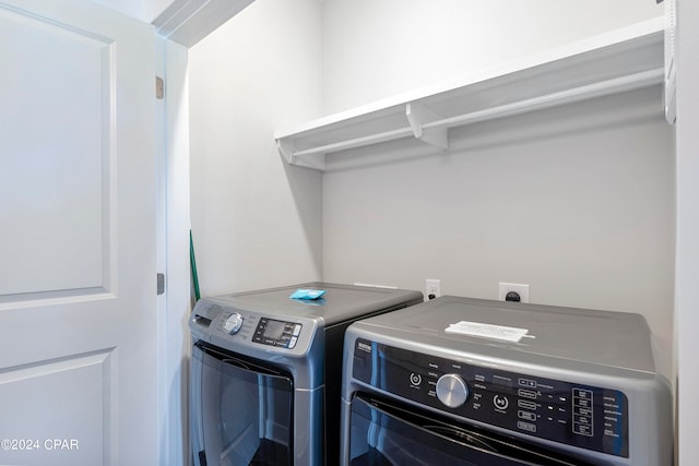 laundry area with washing machine and clothes dryer