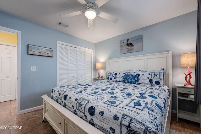 bedroom with ceiling fan and a closet