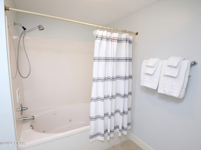 bathroom with shower / tub combo with curtain