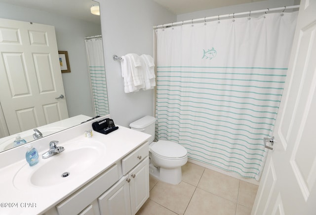 bathroom featuring a shower with shower curtain, tile patterned floors, vanity, and toilet