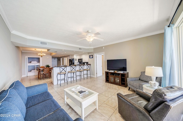 tiled living room with ornamental molding and ceiling fan with notable chandelier