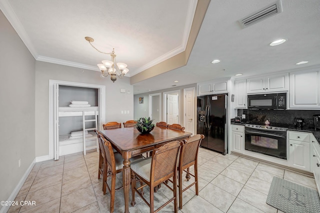 dining room featuring light tile patterned flooring, ornamental molding, an inviting chandelier, and a textured ceiling