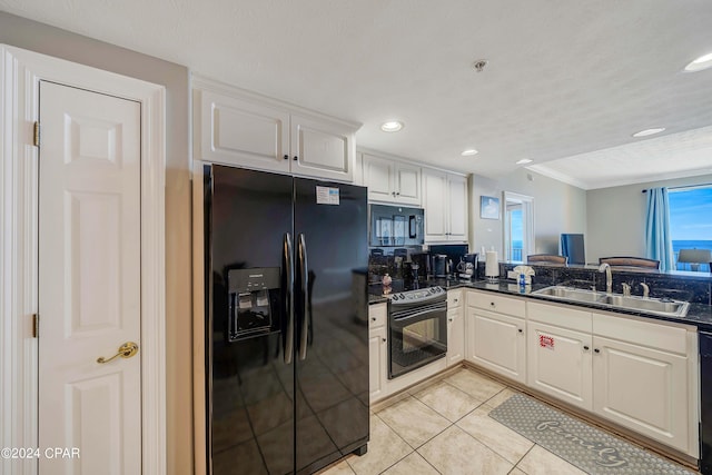 kitchen featuring sink, black appliances, light tile patterned floors, kitchen peninsula, and white cabinets