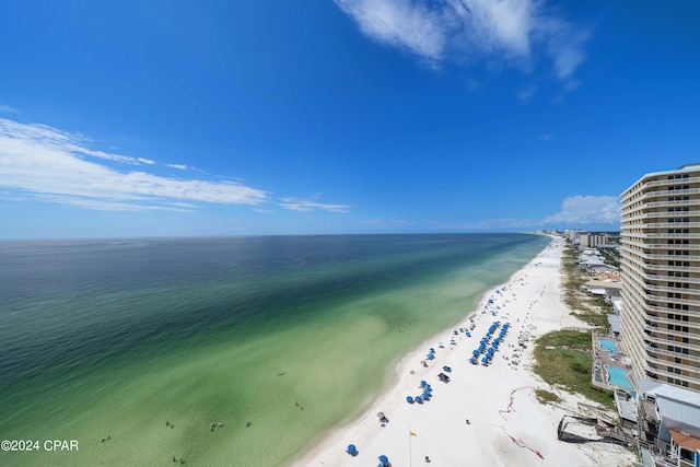 birds eye view of property featuring a water view and a view of the beach