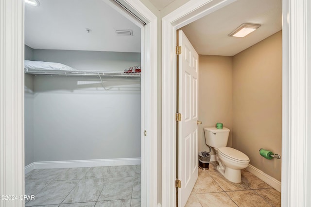 bathroom with tile patterned floors and toilet