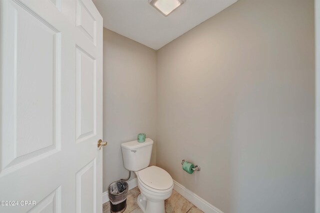 bathroom featuring tile patterned floors and toilet