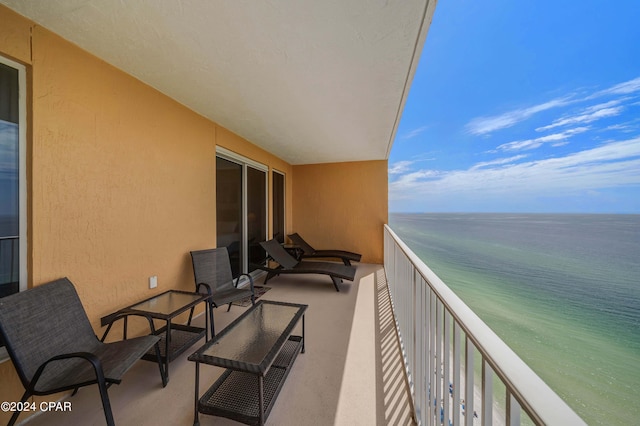 balcony featuring a water view