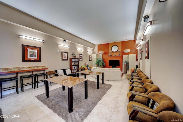 recreation room with light tile patterned floors