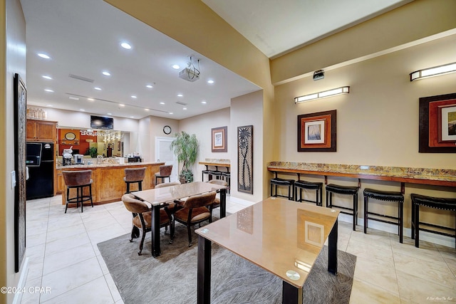 dining space featuring light tile patterned flooring