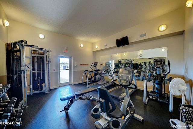 exercise room with a textured ceiling