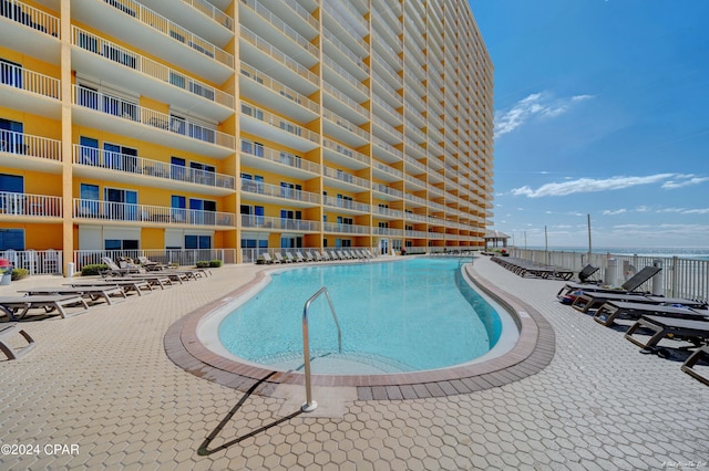 view of swimming pool featuring a patio