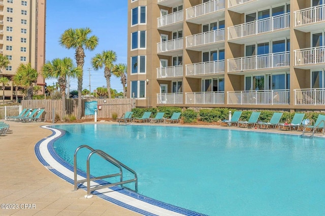 community pool featuring fence