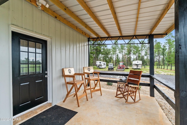 sunroom / solarium with beamed ceiling