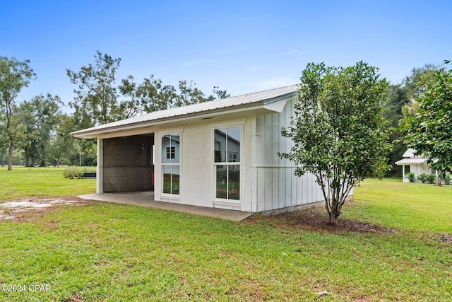 view of home's exterior with a yard