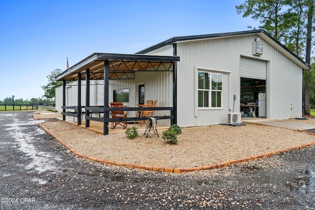 exterior space with an outbuilding and ac unit