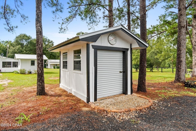 view of outdoor structure with a yard