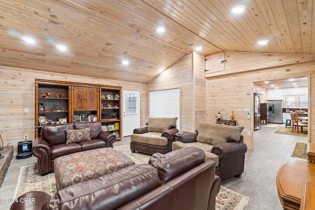 living room with light wood-type flooring, wood walls, lofted ceiling, and wooden ceiling