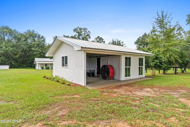 view of outdoor structure with a lawn