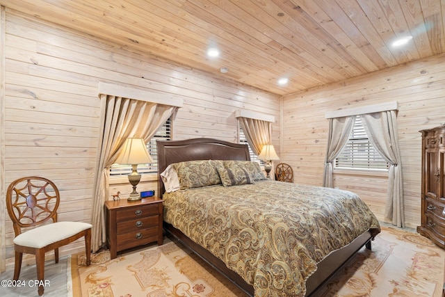 bedroom featuring light hardwood / wood-style floors, wooden walls, and wood ceiling