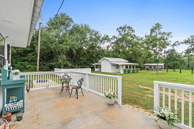 view of patio featuring an outbuilding