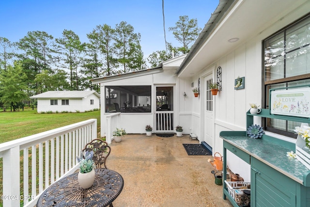 view of patio with a sunroom