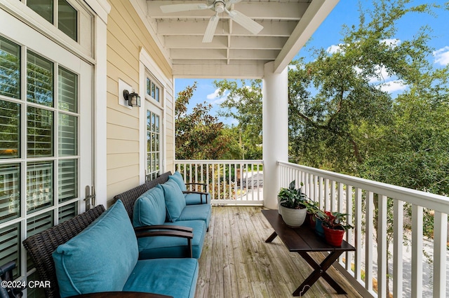 balcony with outdoor lounge area and a ceiling fan