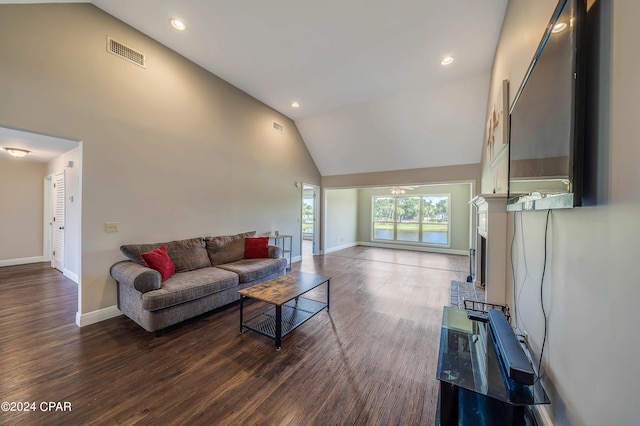 living room with high vaulted ceiling and dark wood-type flooring