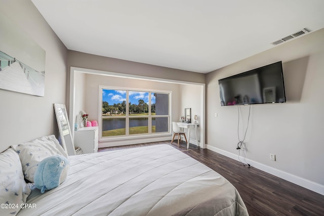 bedroom featuring dark wood-type flooring