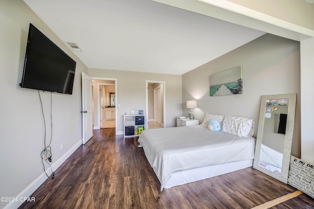 bedroom with dark wood-type flooring