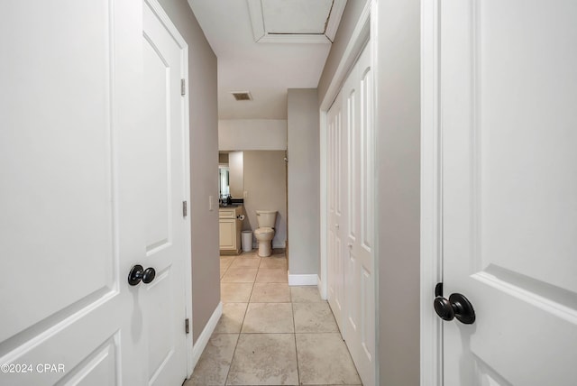 hall with light tile patterned flooring