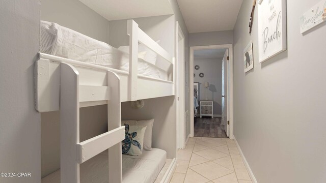 hallway with light tile patterned flooring