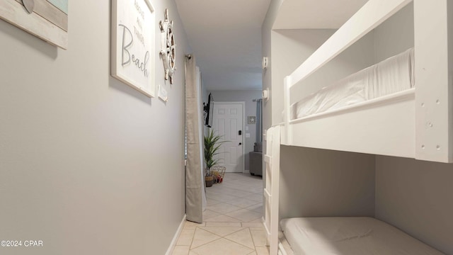 corridor with light tile patterned flooring