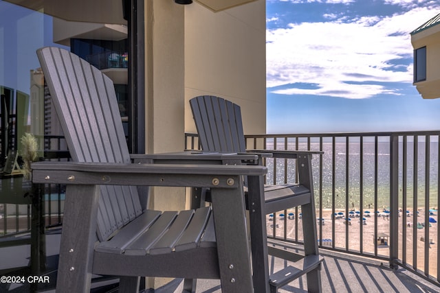 balcony featuring a water view