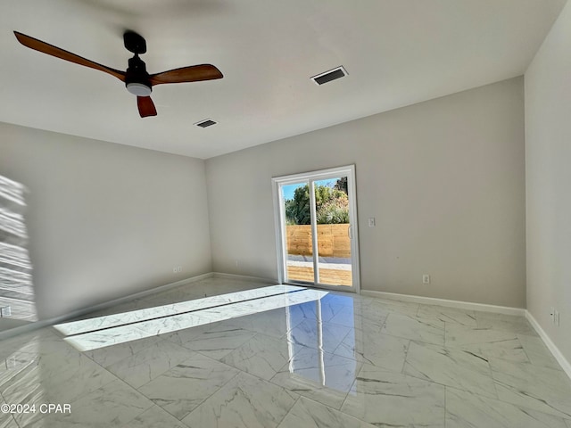 spare room with ceiling fan