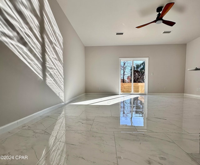 spare room with ceiling fan