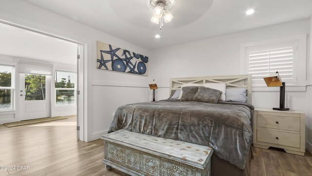 bedroom with wood-type flooring and ceiling fan