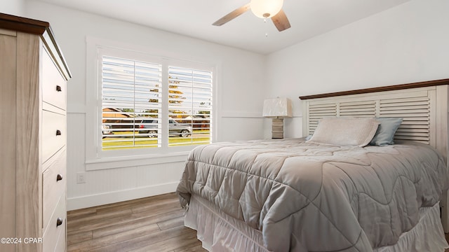 bedroom featuring light hardwood / wood-style floors and ceiling fan