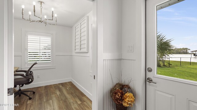 office with a chandelier and hardwood / wood-style floors