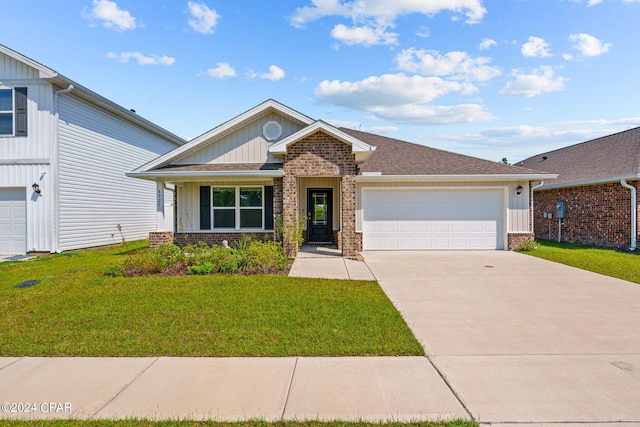 4925 Conner Ln, Panama City, FL 32404 - view of front facade featuring brick siding, a front yard, board and batten siding, driveway, and an attached garage